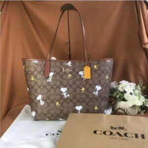 Coach X Peanuts City Tote In Signature Canvas With Snoopy Woodstock Print